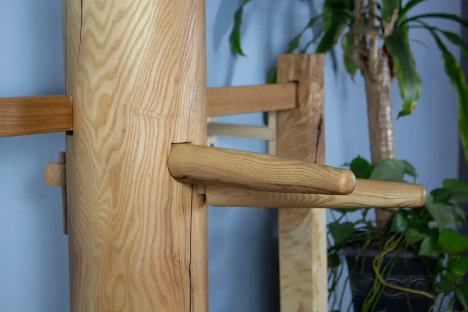 Close-up of handcrafted jong arm joinery showing ash wood grain and craftsmanship by Mike Kilcoyne